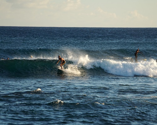 Surfing from a beach on Kauai Island, Hawaii. Surfing from a beach on Kauai Island, Hawaii.